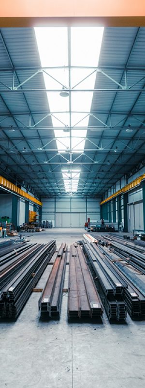 Metal industry manufacturing hall. Steel profiles on the ground.